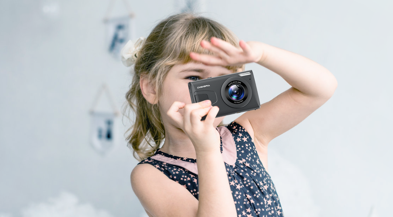 Child holding compact 4K camera for beginners