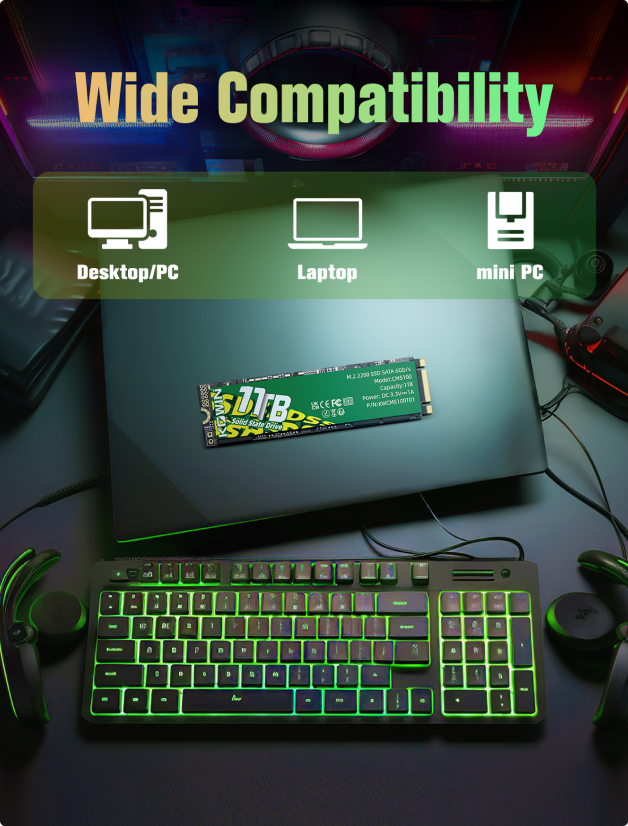 A glowing keyboard, controllers, and a laptop with a CMS100 M.2 SATA SSD on top, all within a colorful gaming setup. Text reads: Wide Compatibility – Desktop/PC, Laptop, mini PC.