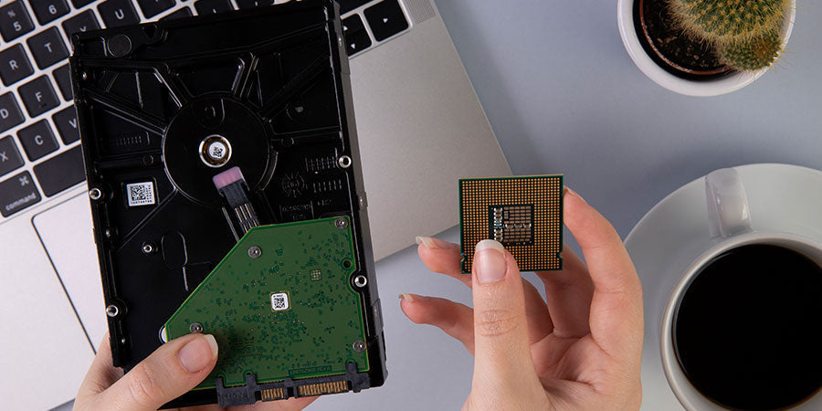 External 1TB portable SSD connected to a laptop for fast data storage.