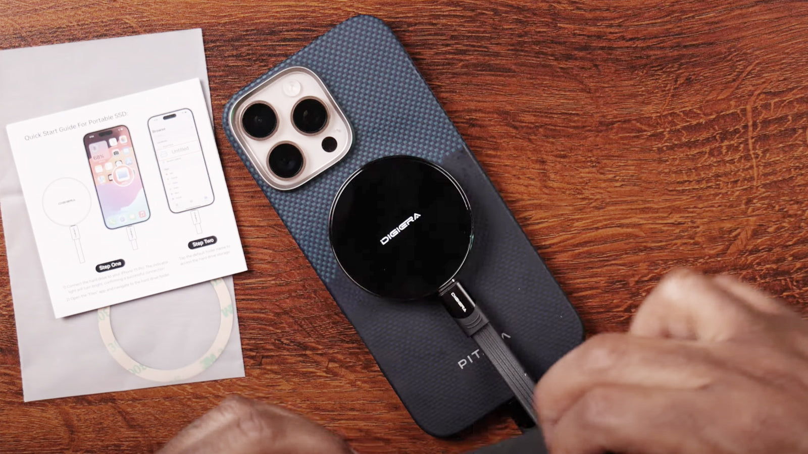 Desktop external hard drive with integrated USB-C hub, multiple ports visible, connected to laptop and accessories for fast data transfer and storage