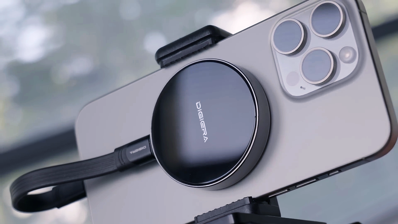 Smartphone connected to a portable SSD for fast external storage and data transfer.