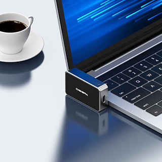 Digiera external SSD with USB-C cable connected to a laptop, showing fast portable storage for large files