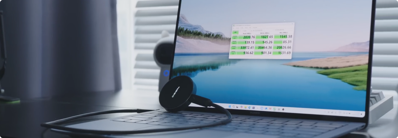 Digiera portable SSD connected to a MacBook via USB-C port, showcasing sleek design and external storage solution for large file backups.